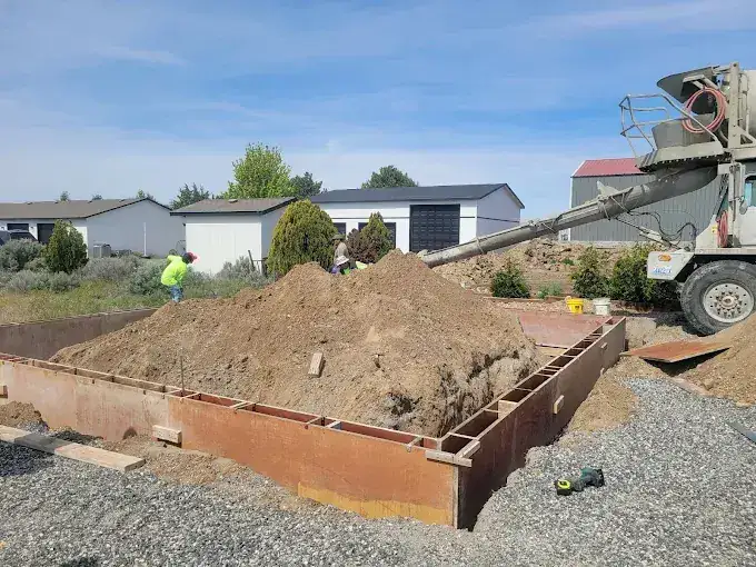 Concrete foundation pour for new construction by J&V Builders in Grant County WA