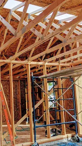 Interior roof truss framing on new residential construction by J&V Builders